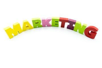 Word MARKETING written with colourful wooden letters, isolated over white with copy space