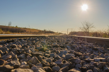Obraz premium Railway leading to the mine territory with a stone balance.