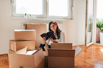 Reading a book while moving to a new apartment.