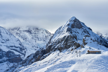 Fototapeta na wymiar Winter mountain view of Tschuggen peak in Jungfrau region of Switzerland.