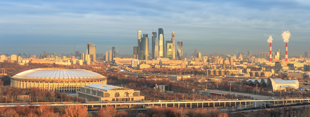 Fototapeta premium Golden morning light over Moscow city with the Luzhniki Stadium