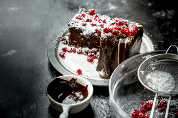 sweet moments - brownies poured hot, liquid chocolate, sprinkled with red pomegranate seeds and powdered sugar