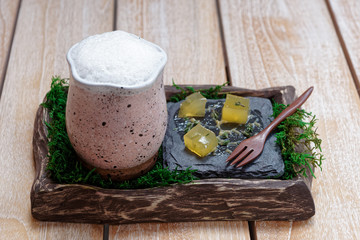 Clay mug with froth cocktail