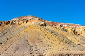 Hill of clay of different shades in the valley of Kyzyl-Chin