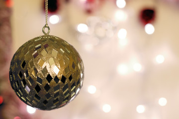 Christmas Holiday Background decorated with golden bauble.