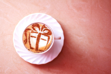 Christmas cappuccino with a gift picture