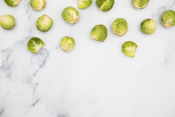 Fresh raw brussel sprouts on a marble background