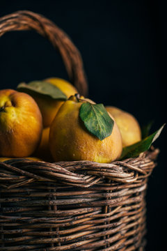 Close up of quince fruits in wicker basket