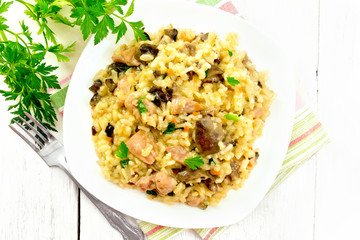 Risotto with mushrooms and chicken on board top