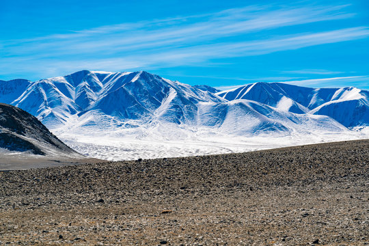 Scenic view of snow covered mountain in summer near Ulgii in Mongolia