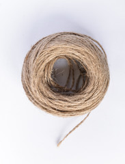 Skein jute twine ball of yarn lies on a white background. isolant