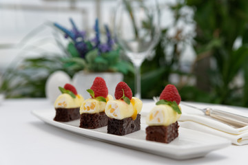 Appetizer with cream cheese, berries and sweet rye bread