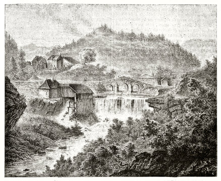 Ancient natural landscape with a stone bridge crossed by a waterfall and a house close to it. Old view of the Maison-Neuve bridge Jura France. Published on Magasin Pittoresque Paris 1839
