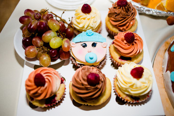 Beautiful cake with cakes in honor of the birth of a son