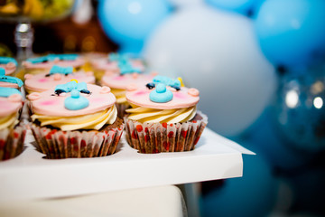 Beautiful cake with cakes in honor of the birth of a son