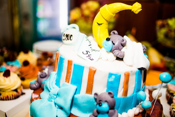Beautiful cake with cakes in honor of the birth of a son