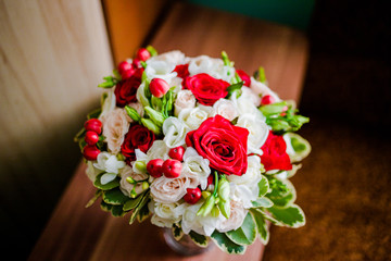 A charming bouquet of white and red roses