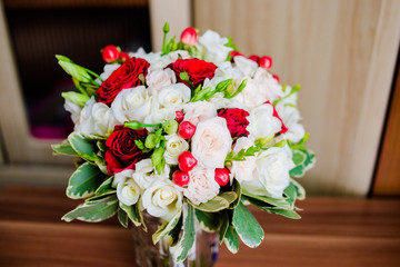 A charming bouquet of white and red roses
