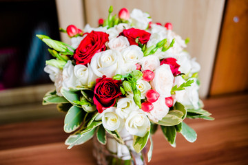 A charming bouquet of white and red roses