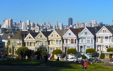 San Francisco, CA / USA - September 2012: The Painted Ladies at Alamo Square with the skyline of the city in the distance