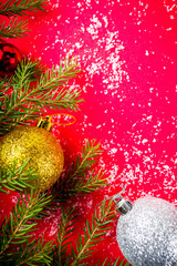 Christmas festive background with xmas tree, decoration on red background copy space banner format above