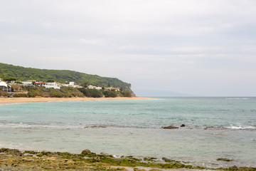 Sandy beach at Trafalgar in spain overlooking the sea and the waves