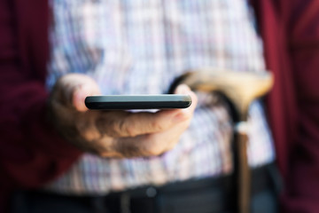 old man using a smartphone