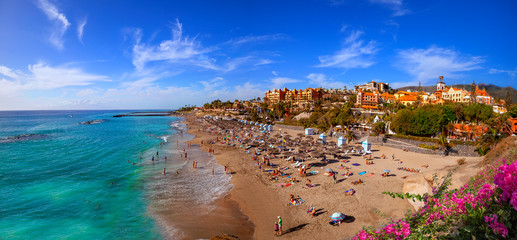 Fototapeta na wymiar Panorama of the famous El Duque beach resort in Tenerife island in summertime in Spain