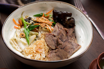 Asian food: beef with rice and greens