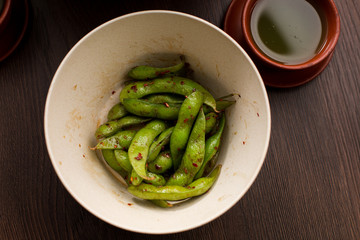 Asian food: pea pods with red pepper