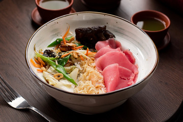 Asian food: rice with tuna and peanuts