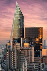 Deurstickers De opvallende architectuur van de City of London bij zonsondergang © moofushi