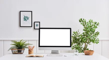Foto op Canvas Home office computer room desktop screen vase of plant frame and office room. © UnitedPhotoStudio