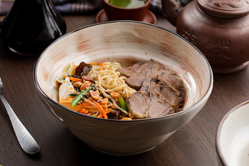 Chinese food: beef with noodles and peanuts
