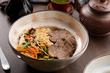 Chinese food: beef with noodles and peanuts