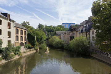 Fototapeta na wymiar Alzette river with houses in Luxembourg from Rue Munster street
