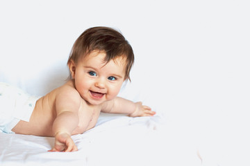 happy baby with long hair on white background smiling