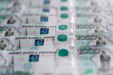 Paper money, Russian rubles, thousandth notes are spread out in order, the money background