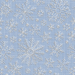 Seamless embroidery snowflakes background.