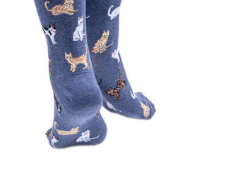 Young woman wearing cat tail crew socks isolated on white background