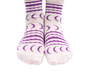 Young woman wearing colorful tail crew socks isolated on white background