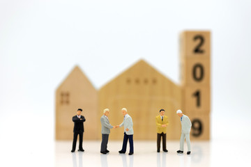 Fototapeta premium Miniature people: Group business meeting guaranteed loan, third party, guarantor. Image use for business concept.