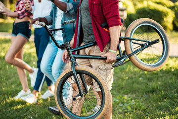 Portrait of confident university students on campus close up, best friends going to park picnic...