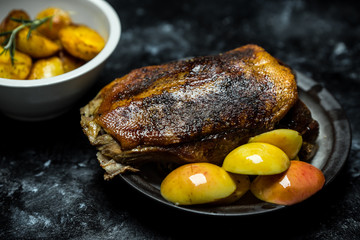 roast duck with sour apples and baked potatoes