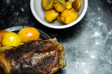 roast duck with sour apples and baked potatoes