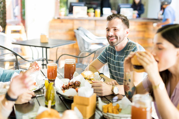 Friends Having Fast Food At Eatery