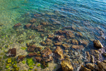 crystal clear water on coast of sea in Antalia Turkey. Close up on shallow water 