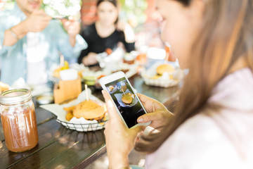 Woman Sharing Cheeseburger Pictures On Networking Site