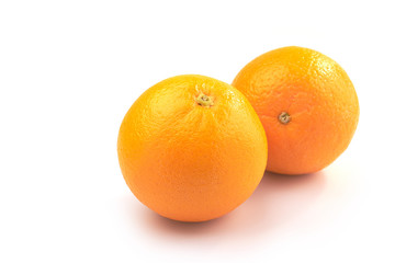 Two orange fruit on white background.