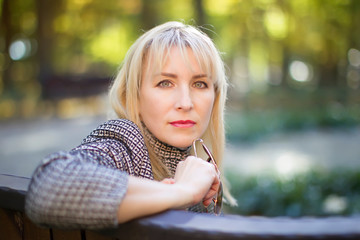 Forty year old woman in the park on the street. Portrait of middle age man